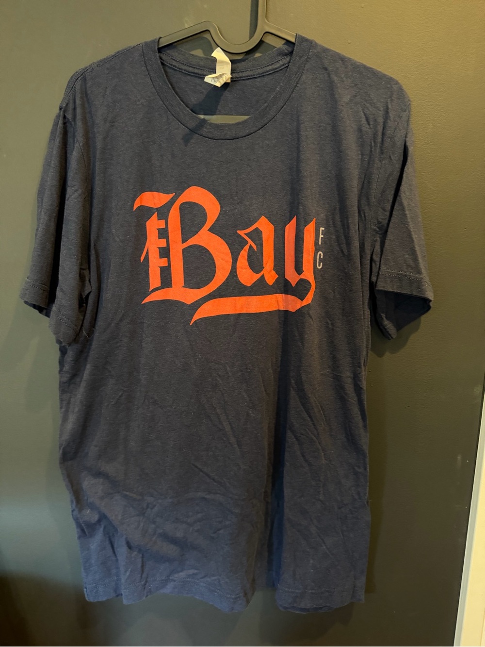Bella Canvas Navy Tee with Orange 'Bay' Graphic